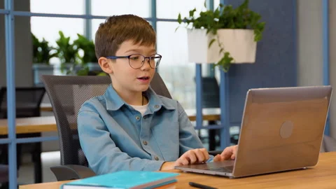 Preteen boy having video online lesson, ... | Stock Video