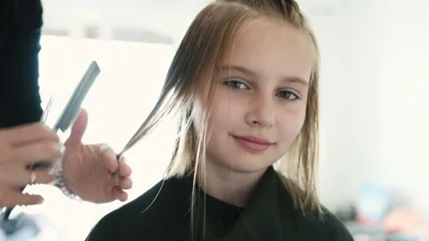 Preteen girl during haircut | Stock Video | Pond5