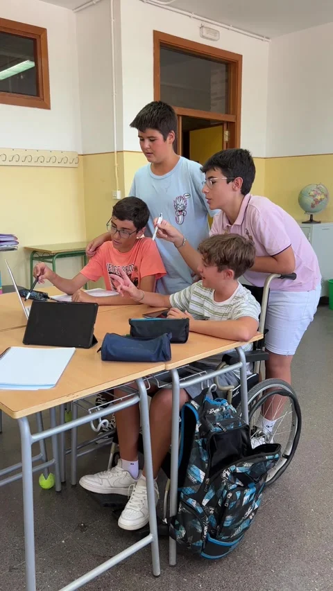 Preteens in class work in groups with laptops and digital tablets. Stock Footage 248956506