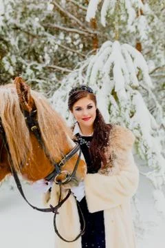 Pretti young model posing with the horse Stock Photos