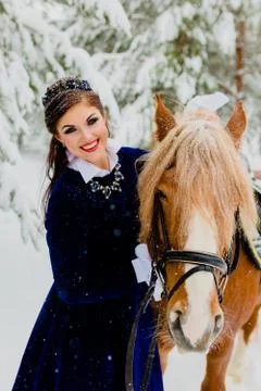 Pretti young model posing with the horse Stock Photos