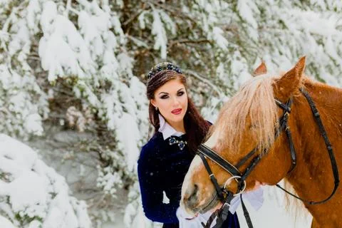 Pretti young model posing with the horse Stock Photos