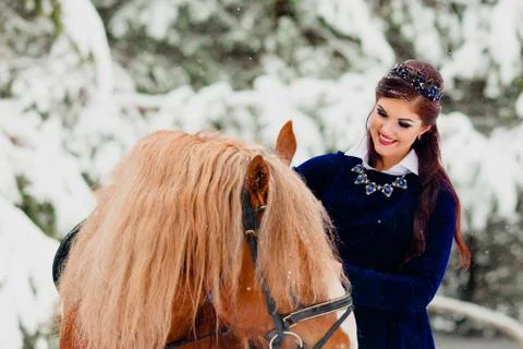 Pretti young model posing with the horse Stock Photos