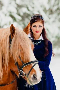 Pretti young model posing with the horse Stock Photos