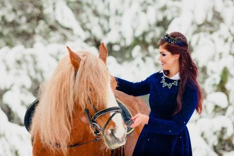 Pretti young model posing with the horse Stock Photos
