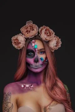 Pretty and scary woman with muertos make up Stock Photos