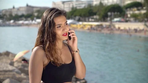 Pretty Arab / middle eastern girl taking seriously on smartphone Stock Footage 78366703