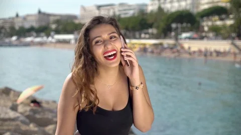 Pretty Arab / middle eastern girl taking on smartphone Stock Footage 78366704