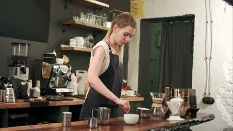 Pretty barista making coffee at cafe, pouring milk to a cup Stock Footage 119096086