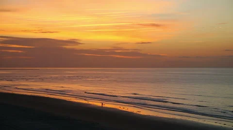 Pretty beach view after sunrise with people walking on the beach Stock Footage 49228405