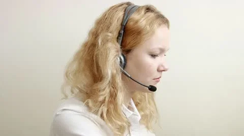 Pretty blond customer service worker helping close up Stock Footage 12554019
