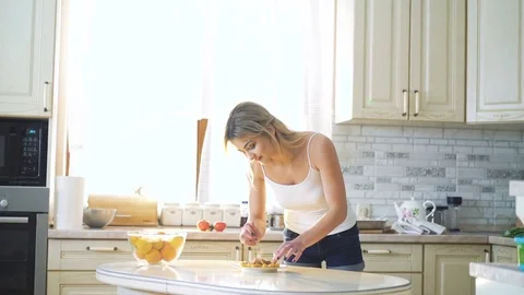 Pretty blonde making dish presentation on the kitchen in 4K 스톡 동영상 72634120