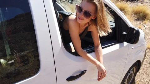 Pretty Blonde Model Leaning Outside the White Van Window While in the Valley 스톡 동영상 112022384