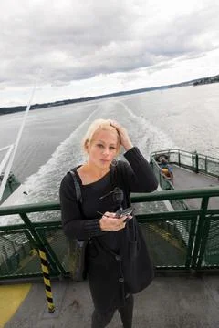 Pretty blonde tourist on a ferry Stock Photos