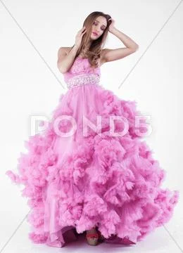 Pretty blonde woman in fashion dress Stock Photos
