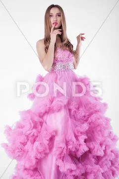 Pretty blonde woman in fashion dress Stock Photos