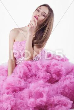Pretty blonde woman in fashion dress Stock Photos