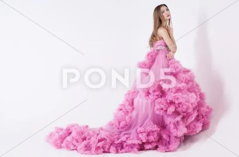 Pretty blonde woman in fashion dress Stock Photos