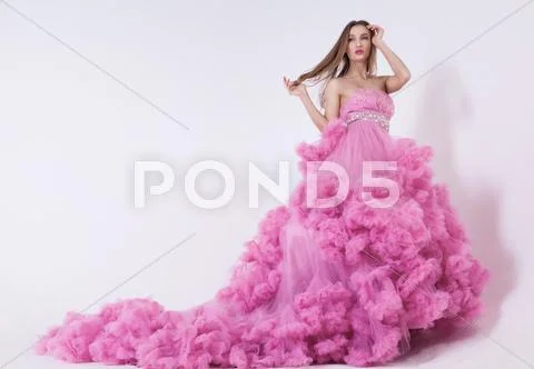 Pretty blonde woman in fashion dress Stock Photos
