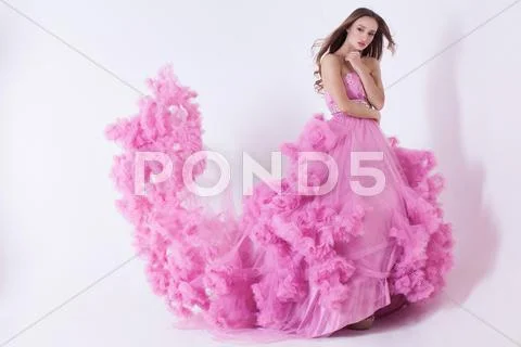 Pretty blonde woman in fashion dress Stock Photos
