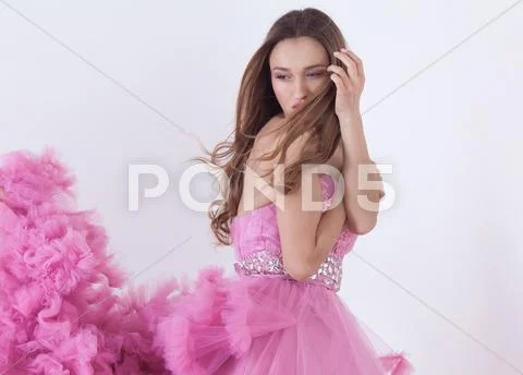Pretty blonde woman in fashion dress Stock Photos