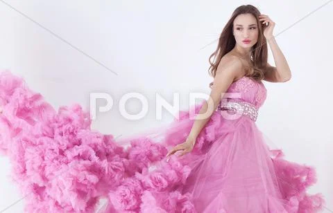 Pretty blonde woman in fashion dress Stock Photos