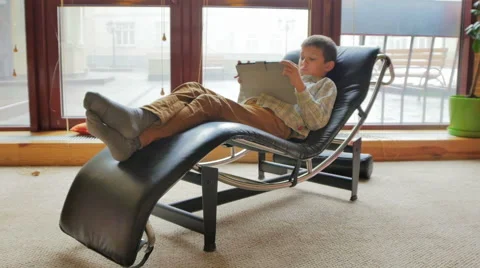 Pretty boy 8-years using tablet computer Stock Footage 46137365