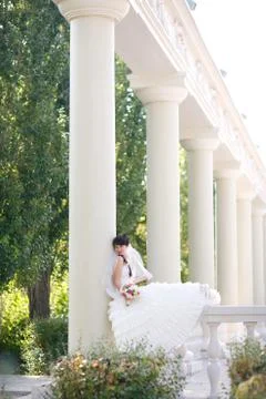 Pretty bride in columns Stock Photos