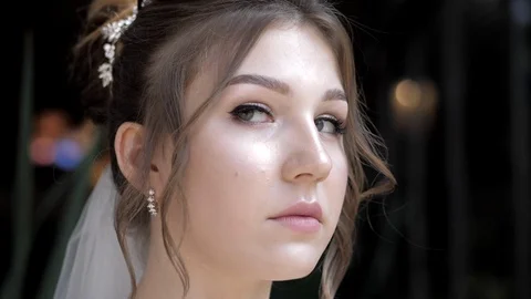 Pretty bride with elegant earrings at wedding slow motion Stock Footage 119628588