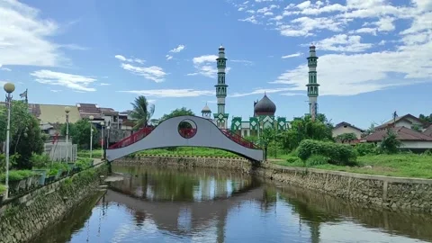 A pretty bridge with Masjid Raya in the background Stock Footage 268130715