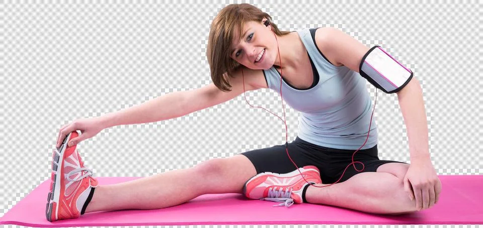 Pretty brunette doing the hamstring stretch on exercise mat 写真素材