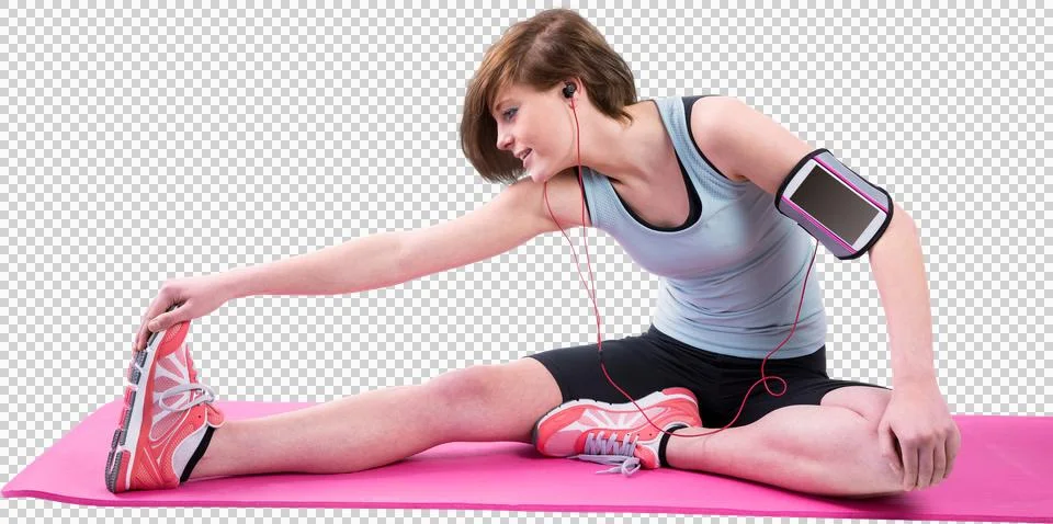 Pretty brunette doing the hamstring stretch on exercise mat 写真素材