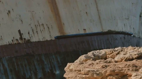 Pretty brunette lady walks near the ship in Cyprus Stock Footage