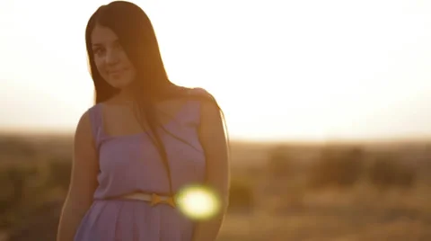 Pretty brunette in sunset light Stock Footage 34130607