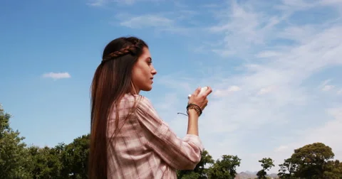 Pretty brunette using her inhaler Stock Footage 49338046
