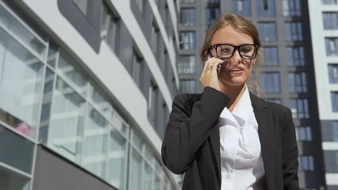 Pretty Businesswoman Talking on Phone Angrily Stock Footage