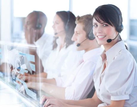 Pretty call center worker using futuristic holographic interface Stock Photos