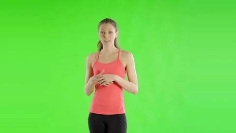 Pretty Caucasian Woman in her 30s isolated on a chroma green background shot in Stock Footage
