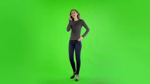 Pretty Caucasian Woman in her 30s isolated on a chroma green background shot in Stock Footage