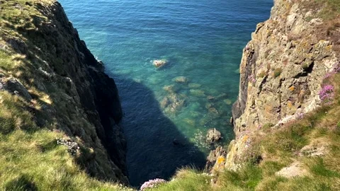 Pretty cliffs on the Welsh coast on the Isle Of Anglesea Stock Footage 154318976