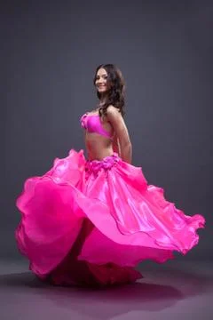 Pretty dancer performing oriental dance Stock Photos