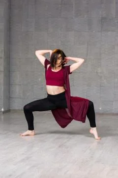 Pretty dancer posing on studio background. Stock Photos