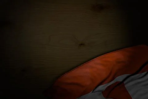 Pretty dark image of Niger flag with big folds on dark wood with free space Ilustración de archivo