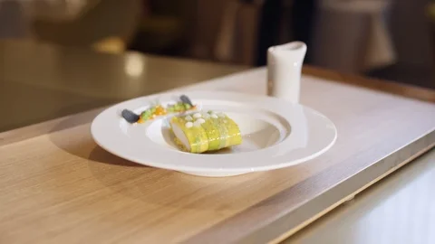 Pretty decorated fish roll on a plate Video stock 118974907
