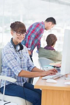 Pretty designer with headphone working on computer Stock-Fotos