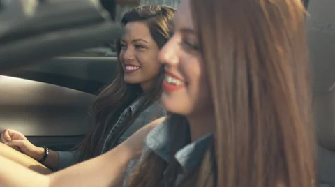 Pretty Driver Getting Ready To Drive Away With Friends In A Convertible Video stock 33822444