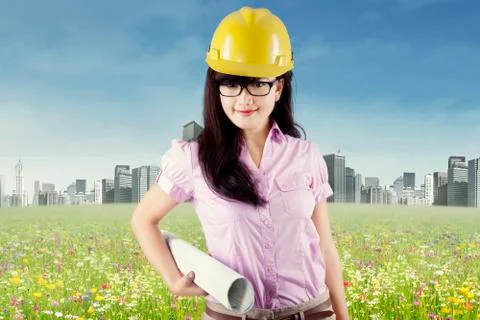 Pretty engineer holding blueprint  Stock Illustration