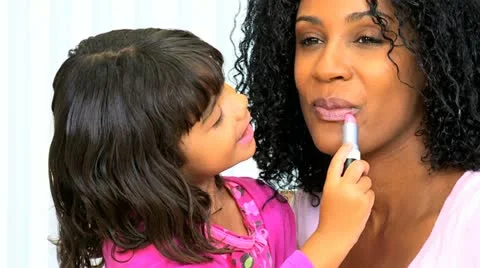 Pretty Ethnic Mom Daughter Using Cosmetics Stock Footage