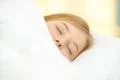 The pretty face of the young girl on the pillow Photo