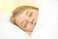 The pretty face of the young girl on the pillow Photo